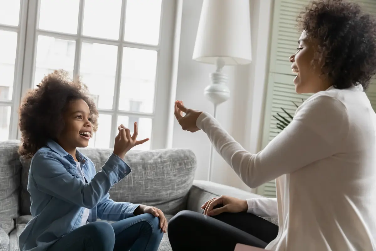 Child trying to communicate with mother. Social communication disorder vs autism